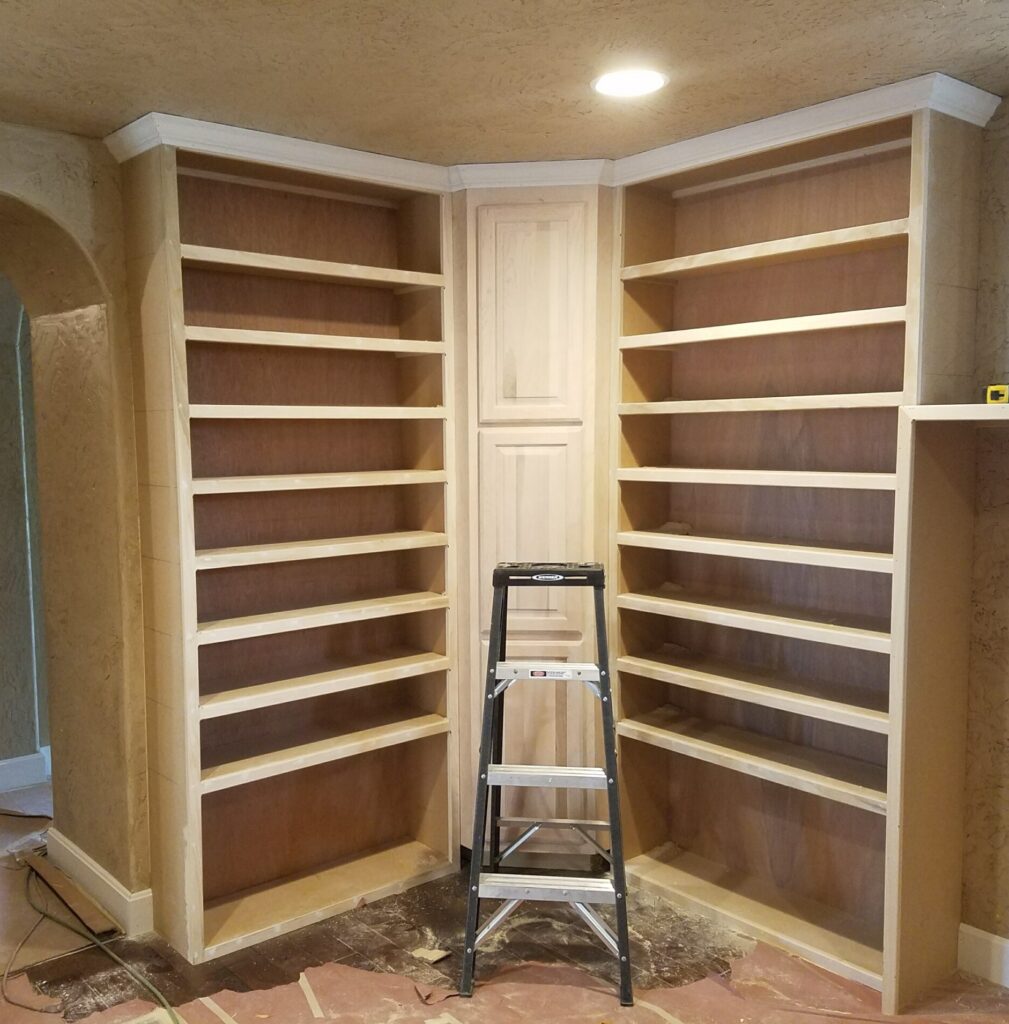 Custom floor-to-ceiling built-in shoe shelf with angled shelving in Springfield Missouri